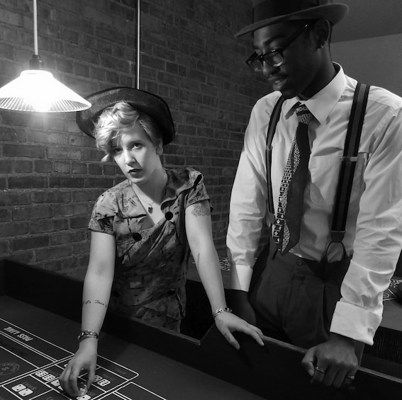 Show item 2 of 6. Couple in vintage clothes gambline
