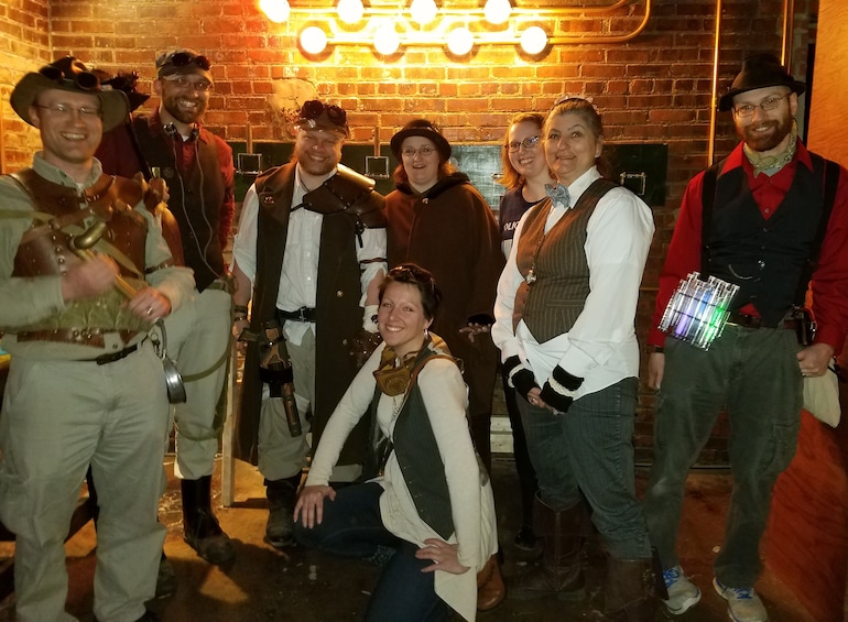 Group in vintage clothes at escape room game