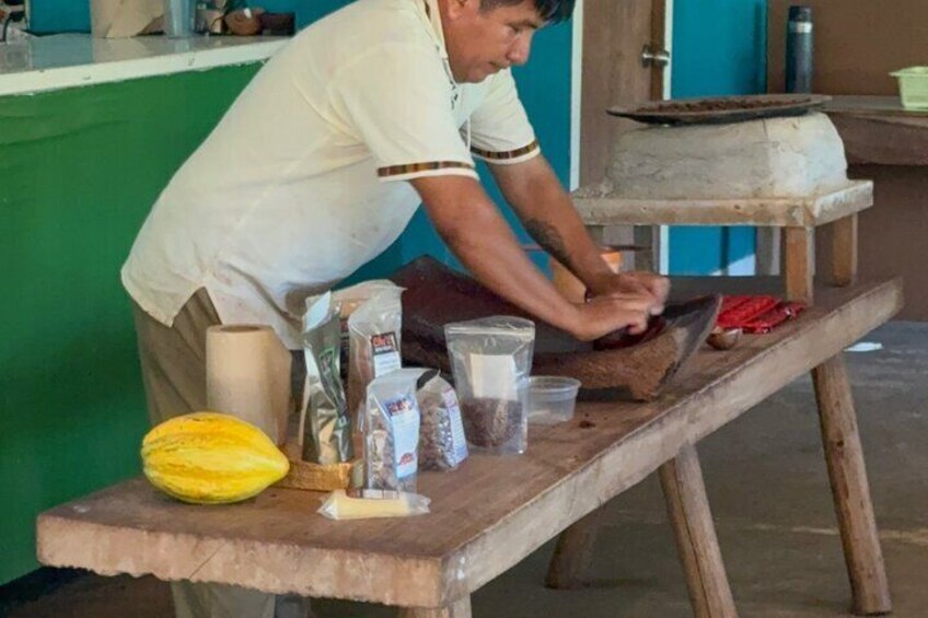 Learning the traditional Mayan way of grinding and making delicious organic chocolate.