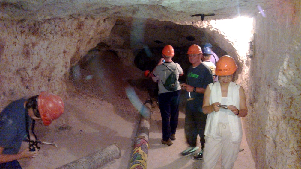 Show item 4 of 4. Group tours a cave in Adelaide
