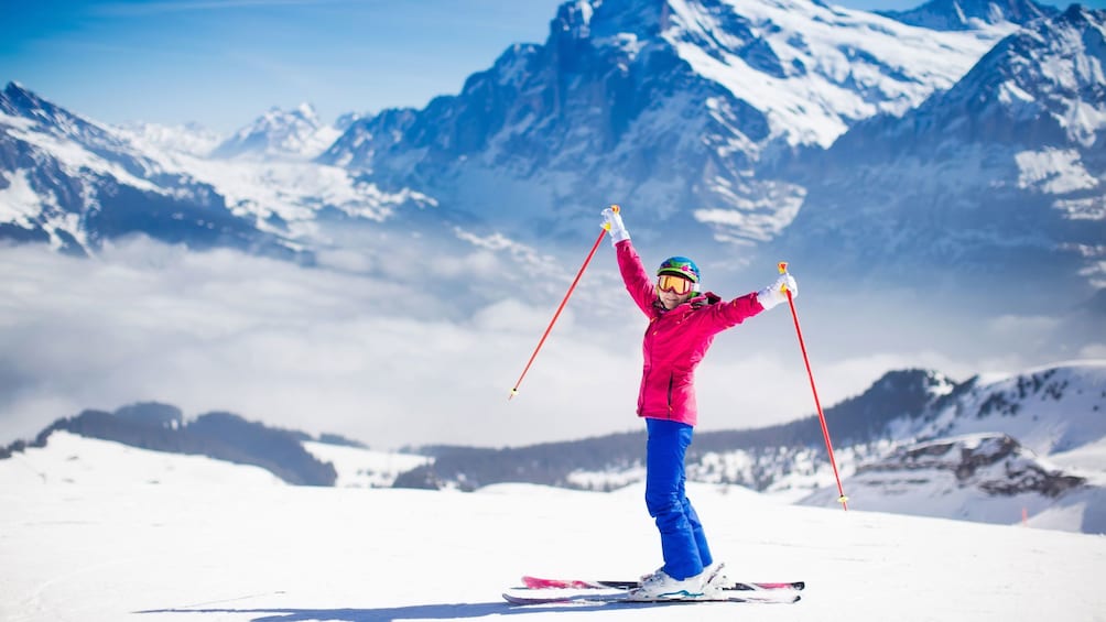 Woman with outstretched arms on skis in Mammoth Lakes, California
