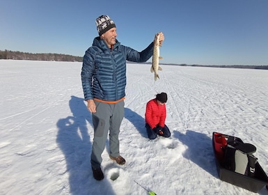 From Helsinki, Ice fishing experience with meal and drink.