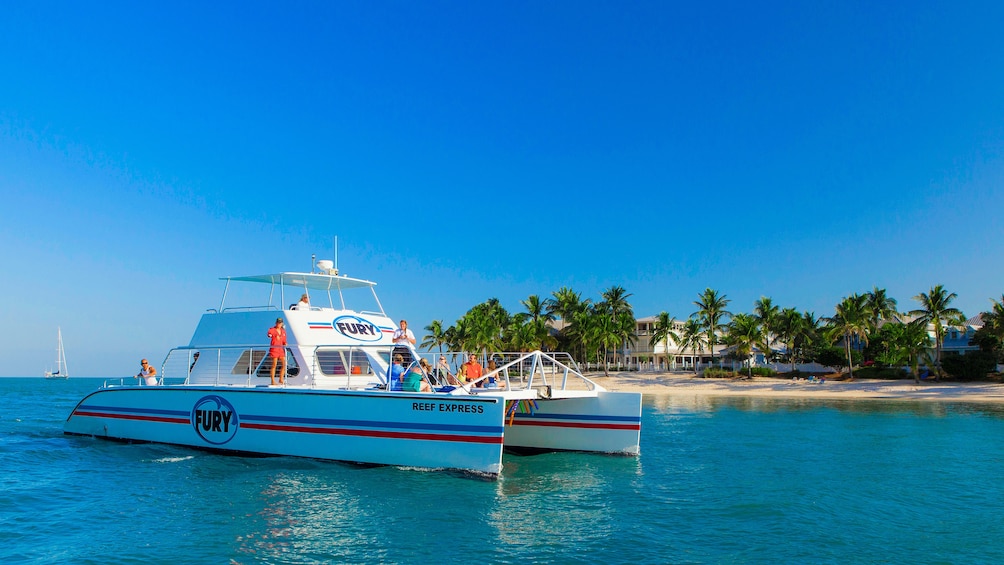 Snorkelers next to a boat off the coast of the Florida Keys