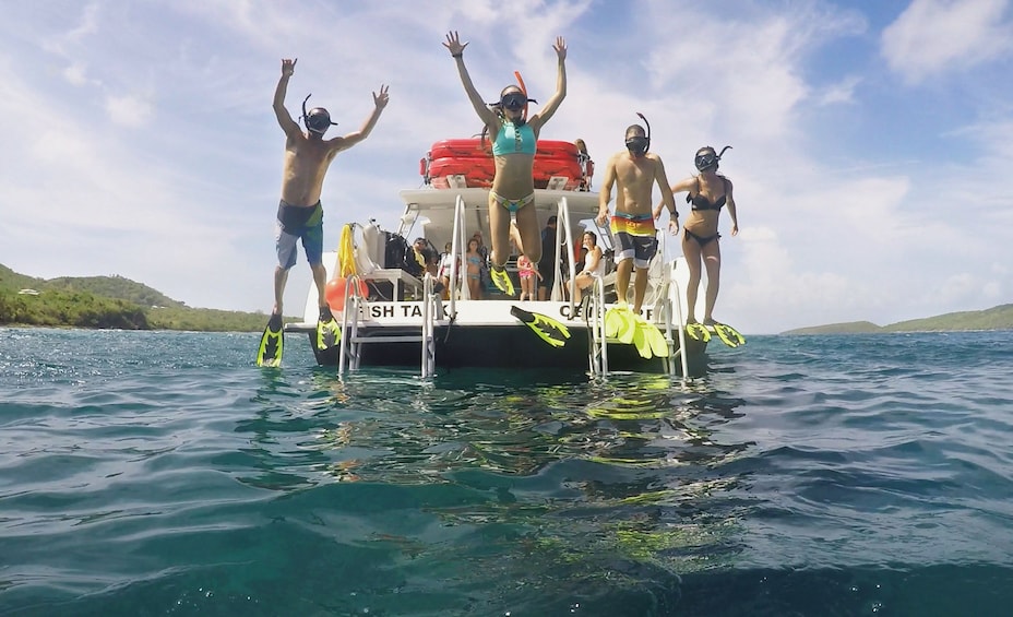 Guests jumping into the water on the Vieques Snorkeling Tour