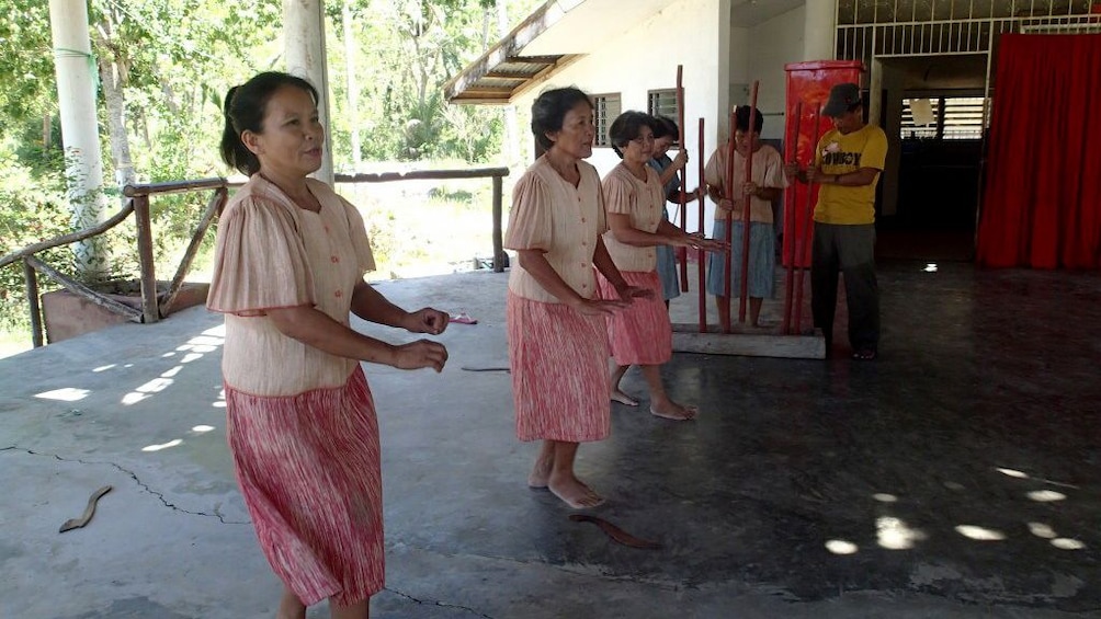 Women dancing at Cambuhat Oyster Farm in Bohol