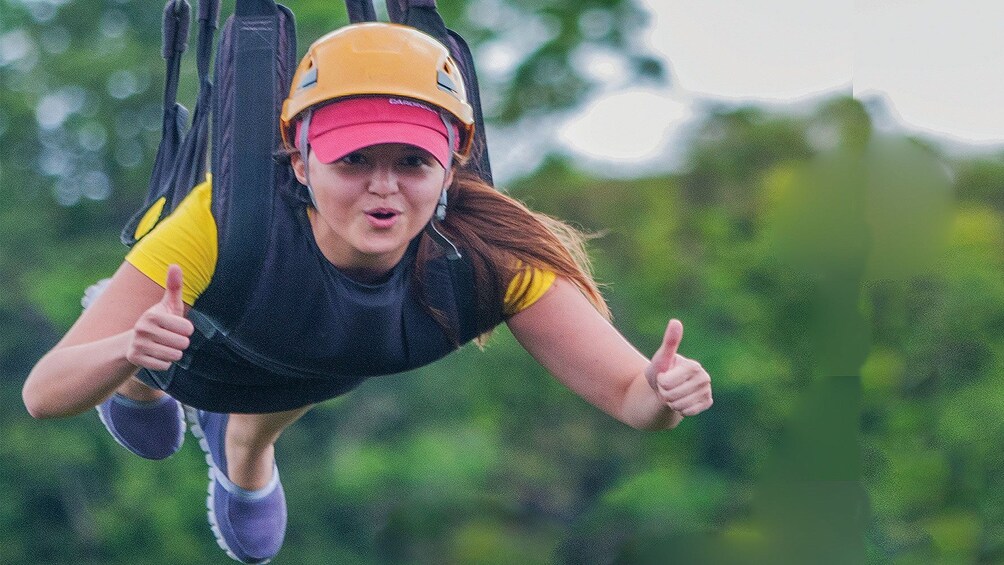 Woman ziplining in Danao Adventure Park