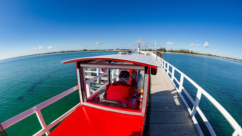 View of small train traveling across Busselton Jetty