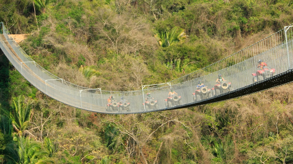 ATV riding group on a bridge in Puerto Vallarta