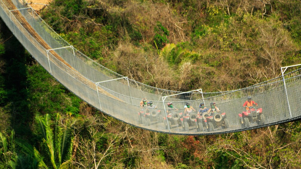 ATV riding group on a bridge in Puerto Vallarta