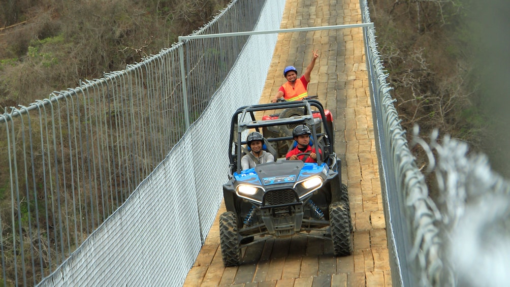 ATV riding group on a bridge in Puerto Vallarta
