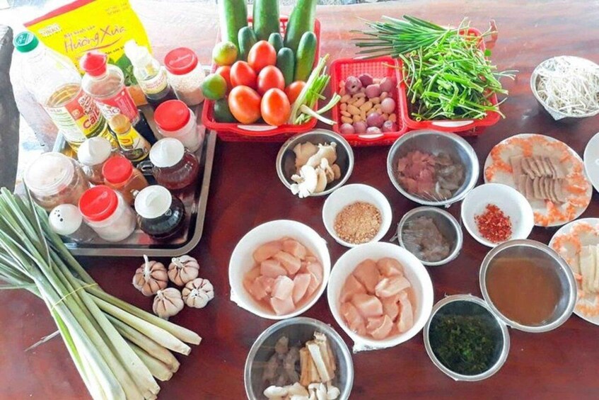 Hue: Traditional Cooking Class w Local Family & Market trip