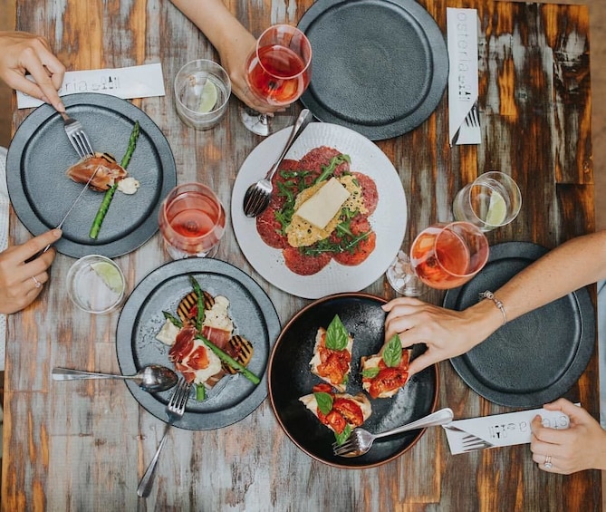 Show item 4 of 4. View of cuisine being shared at restaurant in Australia
