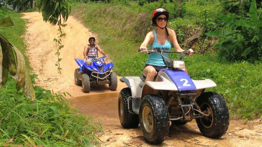 ATV riders on a dirt road in Krabi