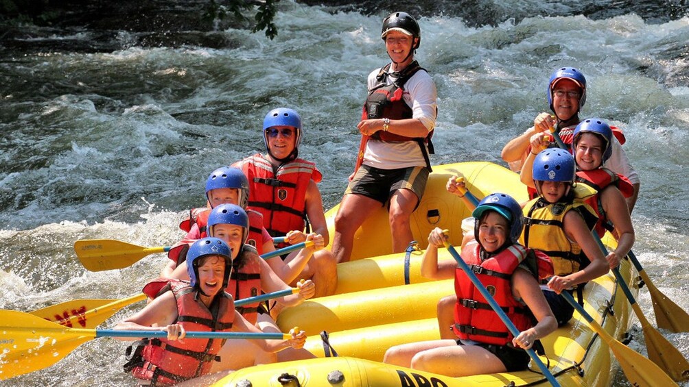 White water rafting group going down a river in Krabi