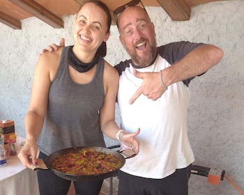 From Sitges: Paella Masterclass with Drink and Bike Ride