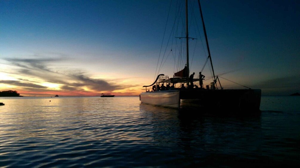 Picture 2 for Activity Grand Bay: BBQ Dinner on Catamaran & Short Sunset Tour