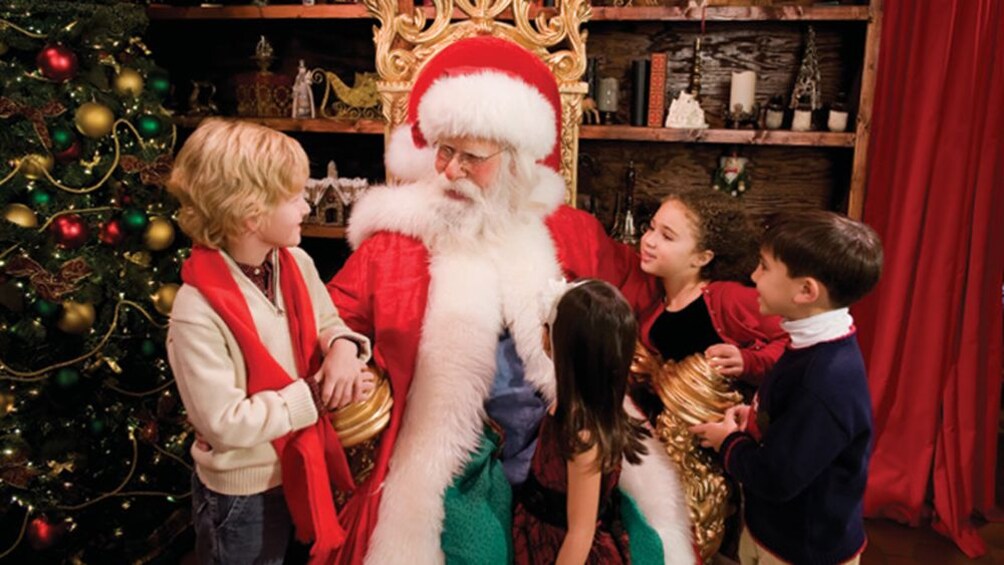 Children gathered around Santa in Williamsburg