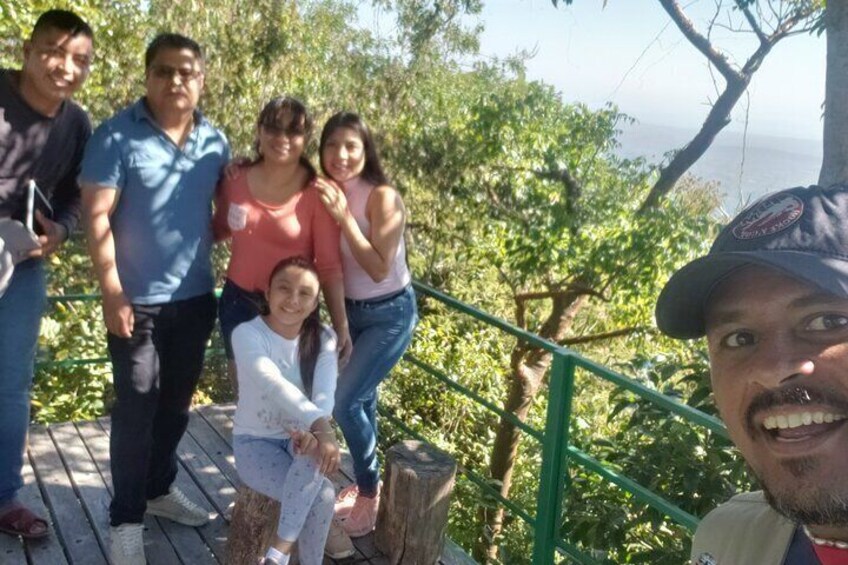 With visitors at the high viewpoint of the Gavilan Mountain
