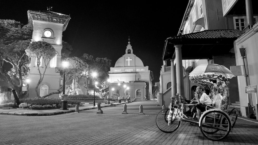 Pedal taxi in a courtyard in Kuala Lumpur at night