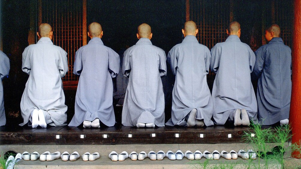 Monks praying in temple in Busan