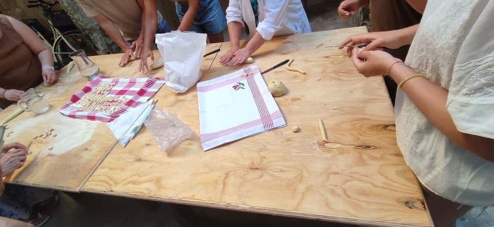 Picture 1 for Activity Lecce: Pasta Making Class in 1400s-Era Courtyard with Wine