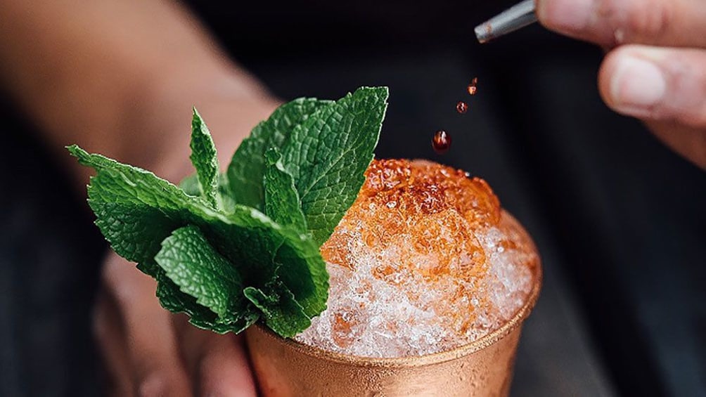 Finishing touches on cocktail during tour in Puerto Rico