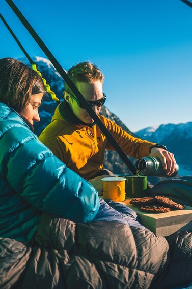 Enjoy a cliff picnic in the fjord landscape of Norway