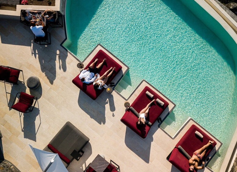 Daybed Relaxation with infinity pool use with caldera views