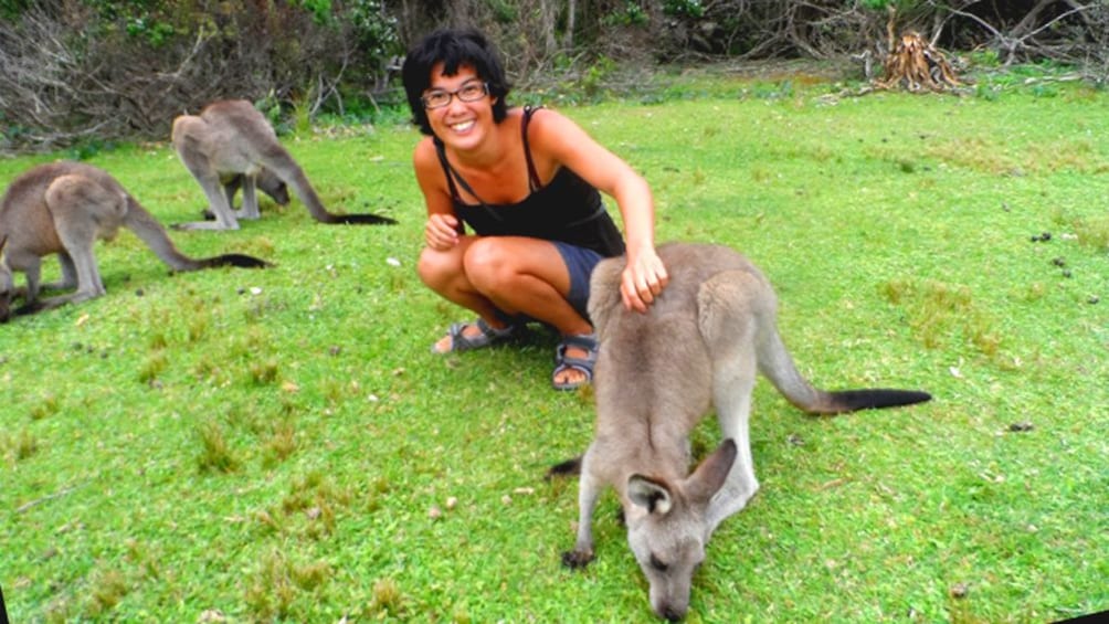 Woman poses with Kangaroos