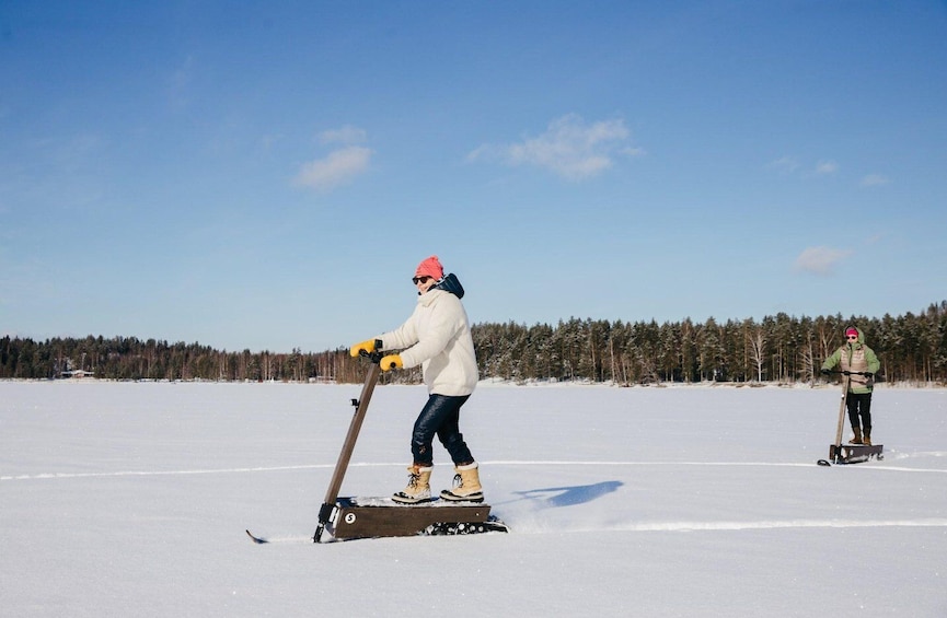 Private safari by electric Snow scooters in Puumala