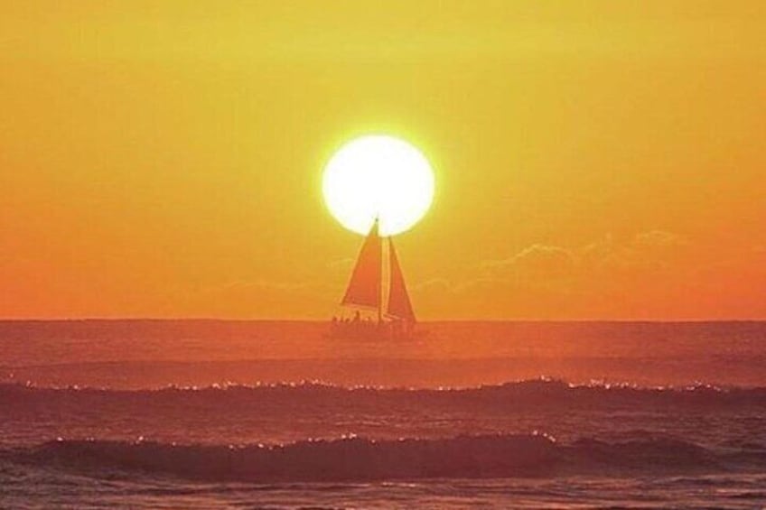 Board from Waikiki Beach for a scenic Sunset Sail on the Hāwea