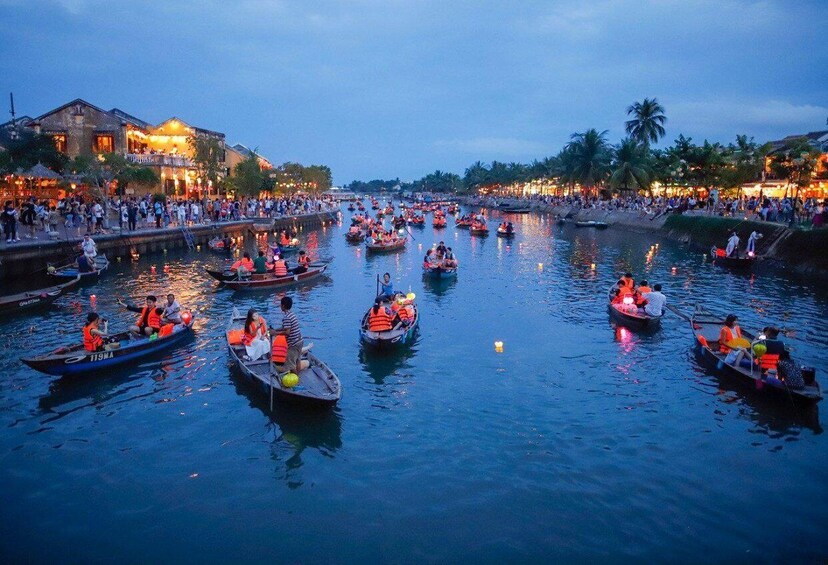 River Boat Ride by Night with Drop Flower Lantern in Hoi An