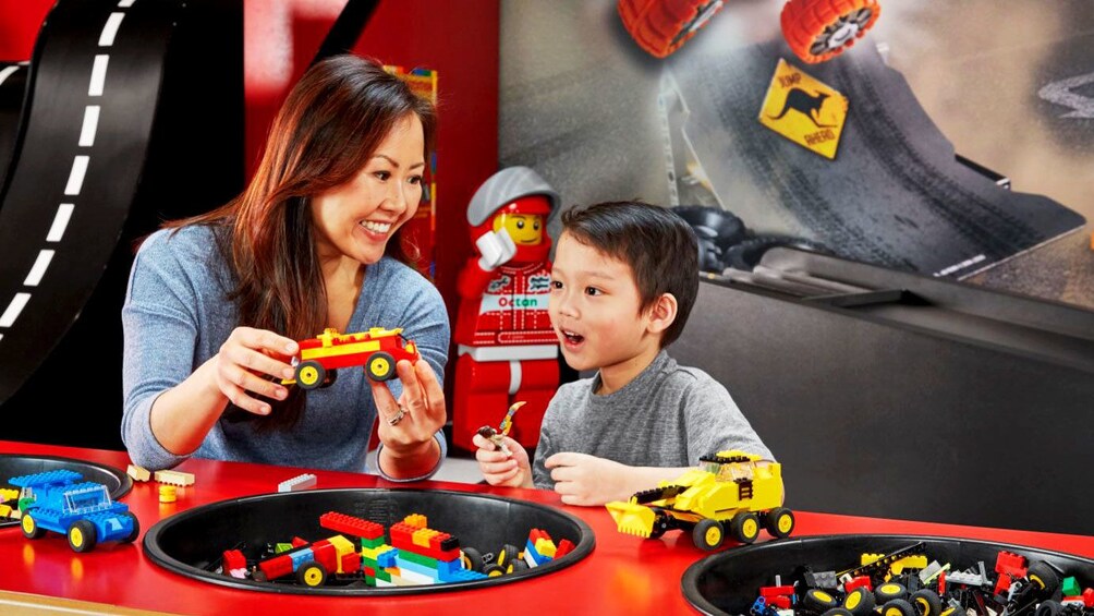 Woman and child playing with Legos in Legoland Discovery Center in Melbourne