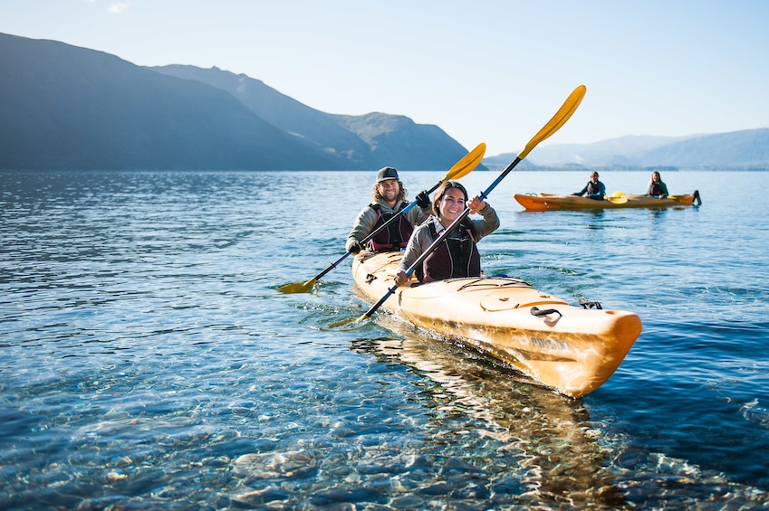 Show item 1 of 4. People out kayaking on Lake Wanaka in New Zealand