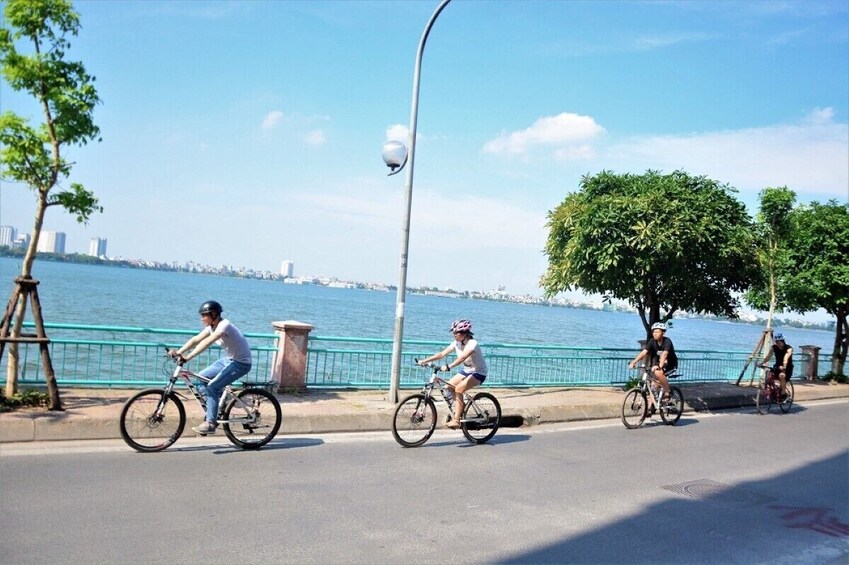 Sunrise Cycling Adventure in Hanoi Lake Views Historic Sites Local Markets