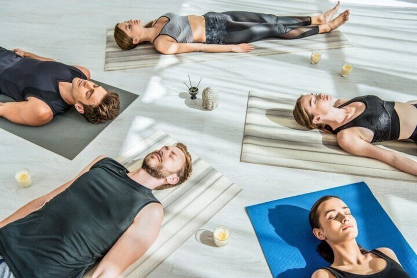 sound bath is lying on yoga mat