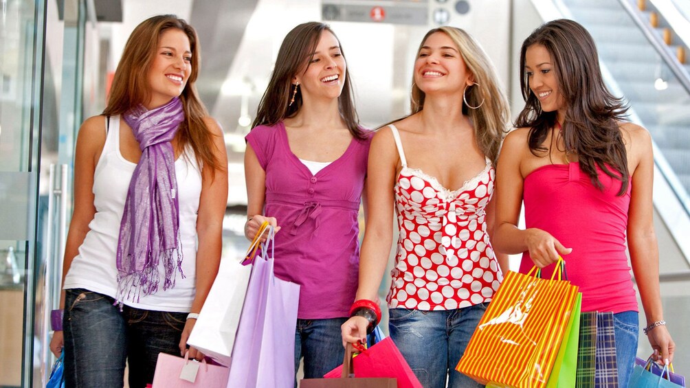Show item 1 of 5. Group of women walking down a street in Alicante