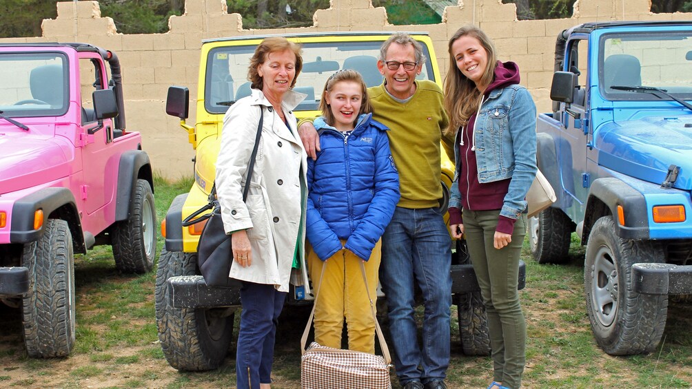 Show item 3 of 5. People posing infront of colorful jeeps in Costa Blanca