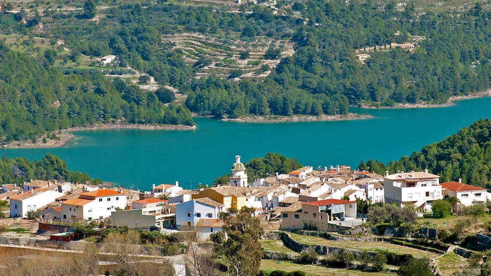 Show item 3 of 5. buildings nestled against the shore in Costa Blanca