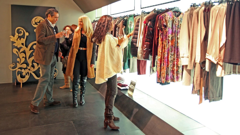 Show item 2 of 5. Women browsing clothes at a store in Valencia