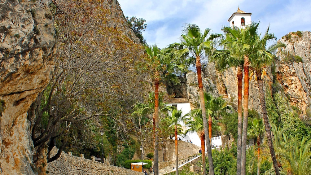 Show item 4 of 5. Looking up at buildings in Guadalest