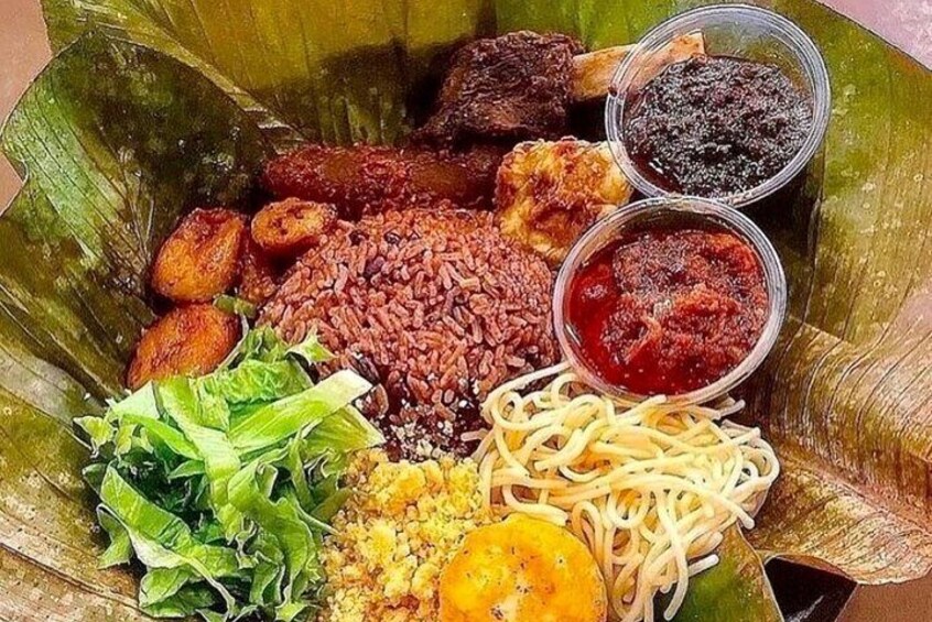 Waakye with side meals and gravy.