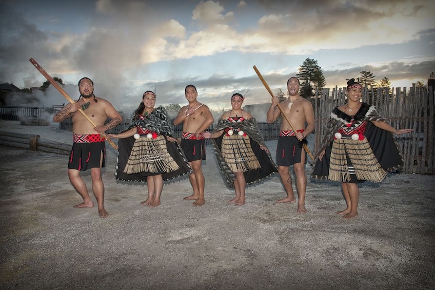 Show item 1 of 7. Six people dressed in traditional Maori clothing