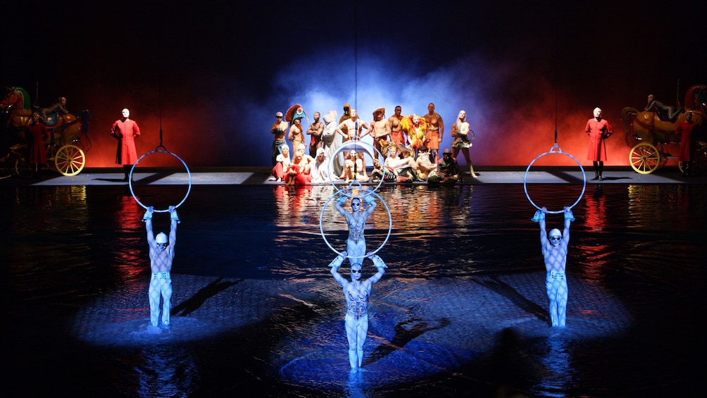 People hang from rings over pool in Cirque du Soleil O at the Bellagio in Las Vegas