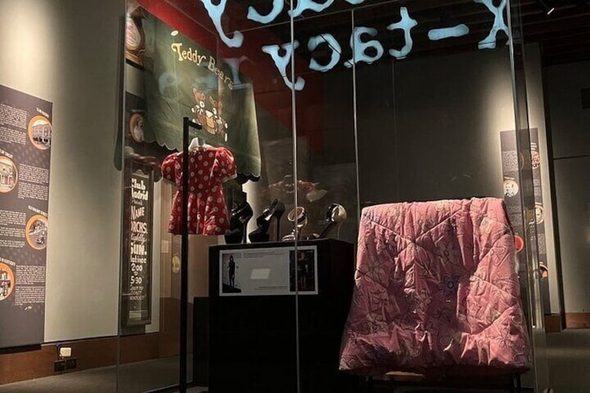 Items on loan from Jennifer Lawrence. Items include a costume from her childhood, shoes from the red carpet, and a blanket she used on the Late Show with David Letterman.