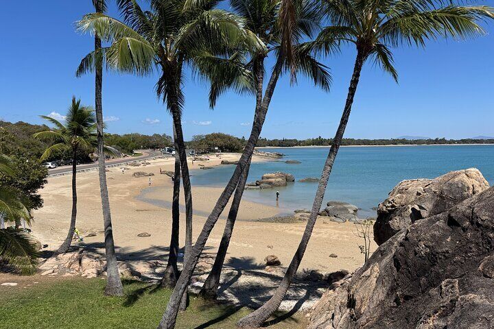 Tropical paradise at Horseshoe Bay – one of Bowen’s most beautiful beaches, framed by palm trees and crystal-clear Whitsunday waters.