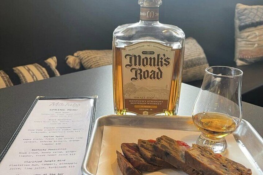 A pour of Monk's Road Wheated Bourbon along with Bourbon Fruit Cake made by the Monk's at the Abbey of Gethsemani