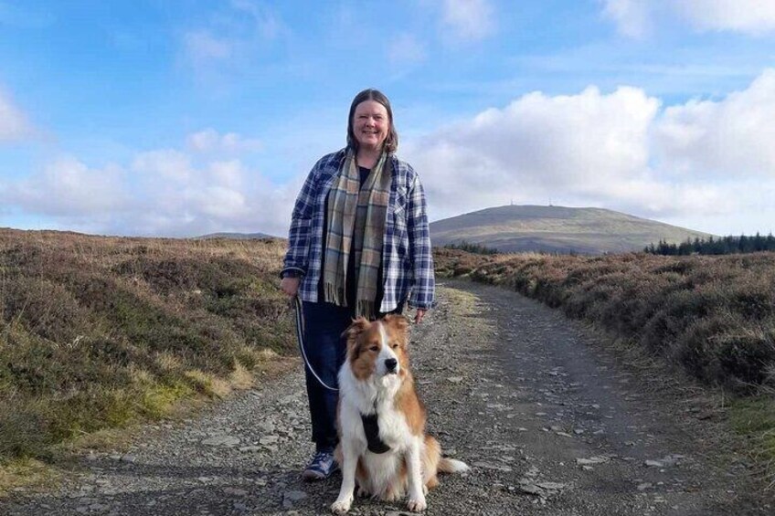 Louise with with her Sable Border Collie Max in the upland countryside 