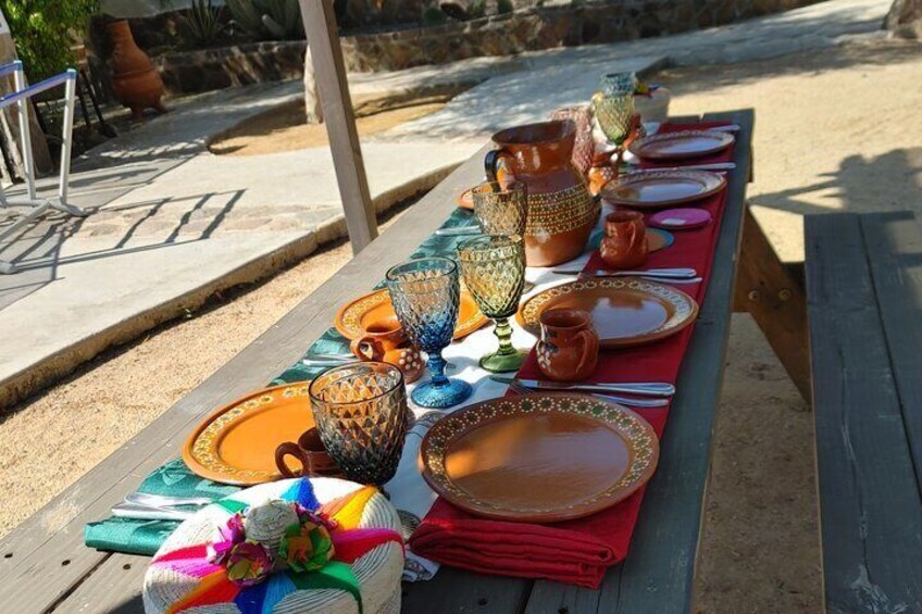 We dine outdoors at Hacienda Eco-Domes (weather permitting). For inclement weather , we have our fiesta inside