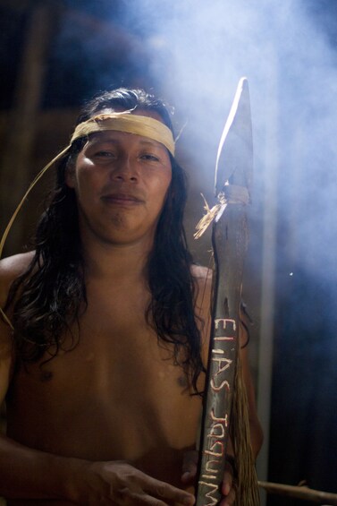 Man in indigenous clothing with spear in Costa Rica